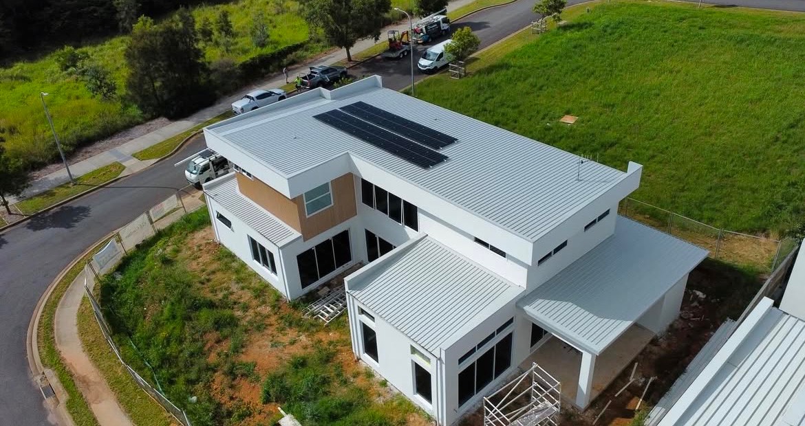 Modern home showcasing exterior painting and roof coating